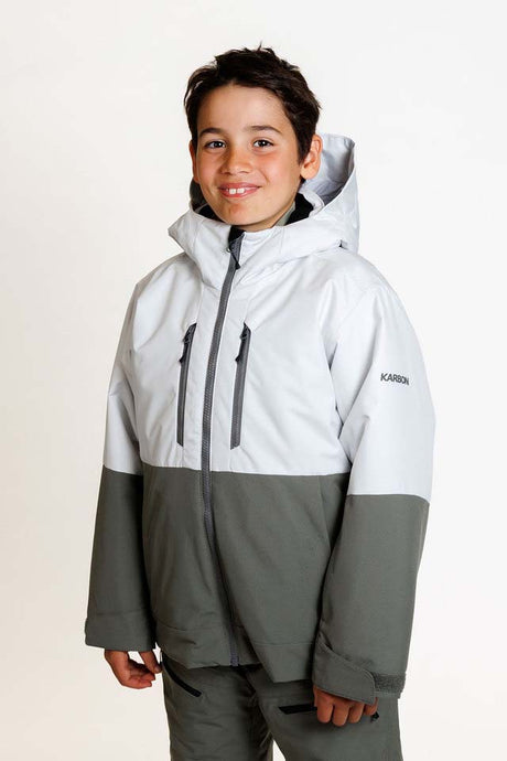 SquallKidsInsulatedJacket-A young boy wearing a color-blocked ski jacket in white and gray, with matching gray pants, photographed against a clean white studio background.