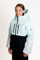 SquallKidsInsulatedJacket-A young girl wearing a light blue and black color-blocked hooded jacket with light gray sleeves, standing against a plain white studio background.
