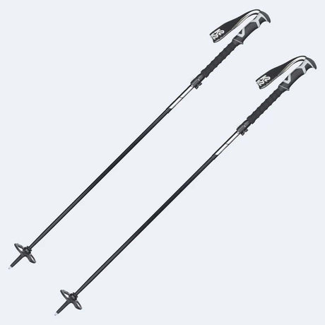 SwiftStickPole-Two black and silver ski or hiking poles with textured black grips and white logo details, shown on a light gray background.