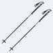 SwiftStickPole-Two black and silver ski or hiking poles with textured black grips and white logo details, shown on a light gray background.