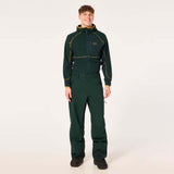 TCEarthPant-Person wearing a green work suit with yellow accents on a white background