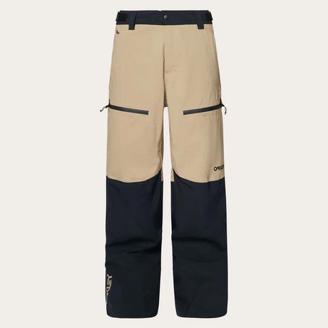 TNPShellPant2.0-Beige and black pants with a brand logo on a light gray background