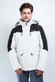 TritonMensInsulatedJacket-A man wearing a Karbon colorblock ski jacket in off-white and black, paired with gray pants, standing against a light gray studio background.