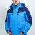 TritonMensInsulatedJacket-A man wearing a blue and navy Karbon ski jacket, standing against a light gray studio background.