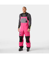 UllrDBibShellPant- Pink bib overalls with black accents on a white background