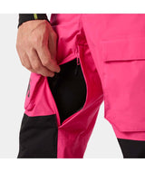 UllrDBibShellPant- Pink bib overalls with black accents on a white background