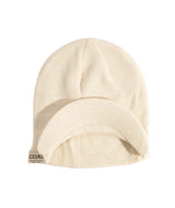 UniformBrimBeanie- Off white beanie with a brand label on a white background