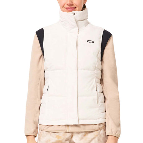 WAutumnRCVest-Person wearing a beige and white puffer vest with a brand logo on a white background