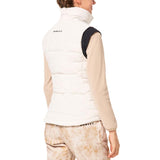 WAutumnRCVest-Person wearing a white puffer vest over a beige long-sleeve shirt on a white background