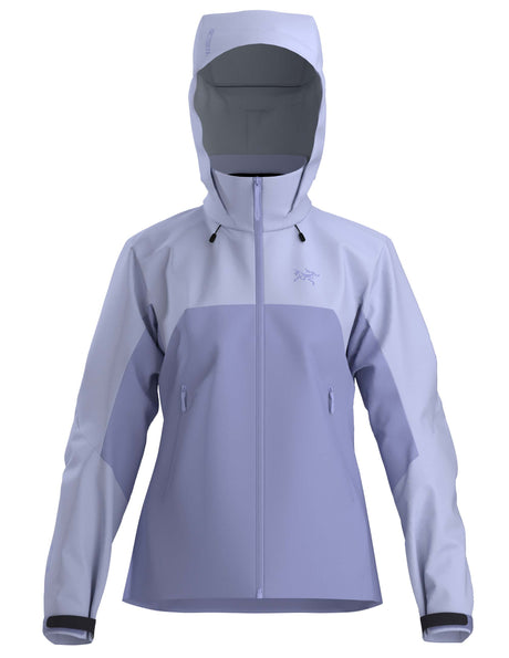 WBetaARJacket-A women's hooded technical jacket in a two-tone light purple and pale blue colorway, featuring a full-front zipper, zippered hand pockets, and a subtle Arc'teryx logo on the left chest.
