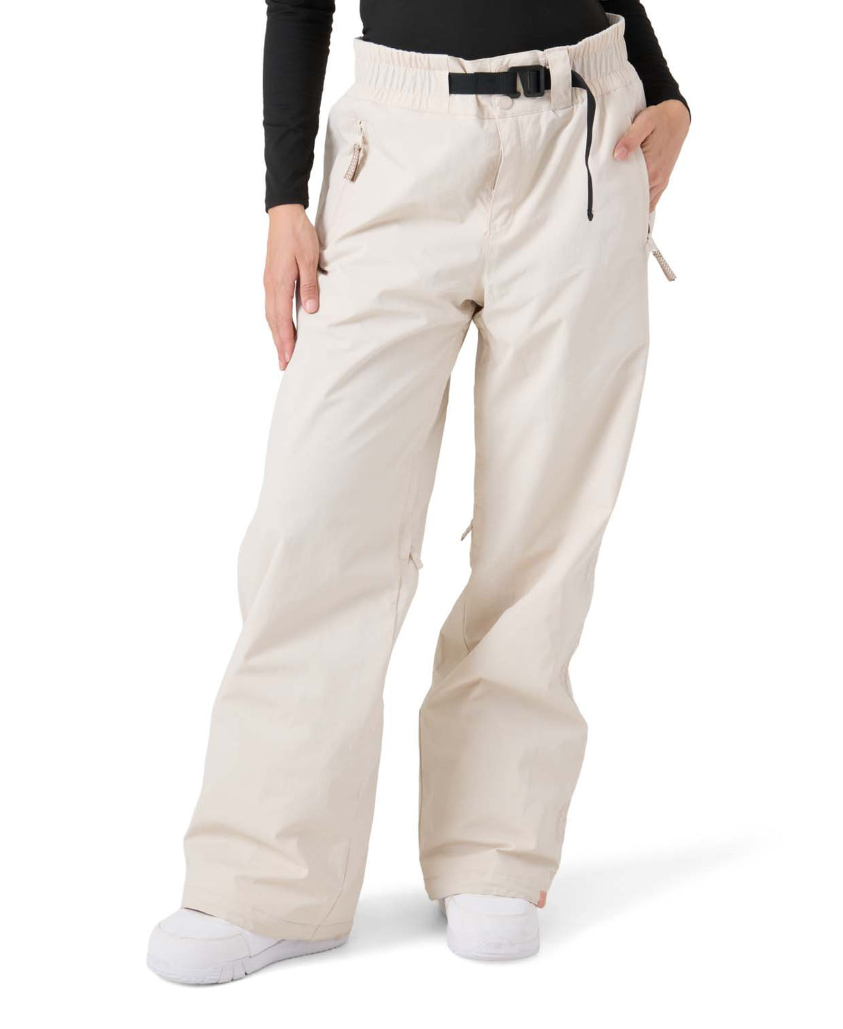 WBleekerPant- Woman wearing cream snow pants with black belt on a white background