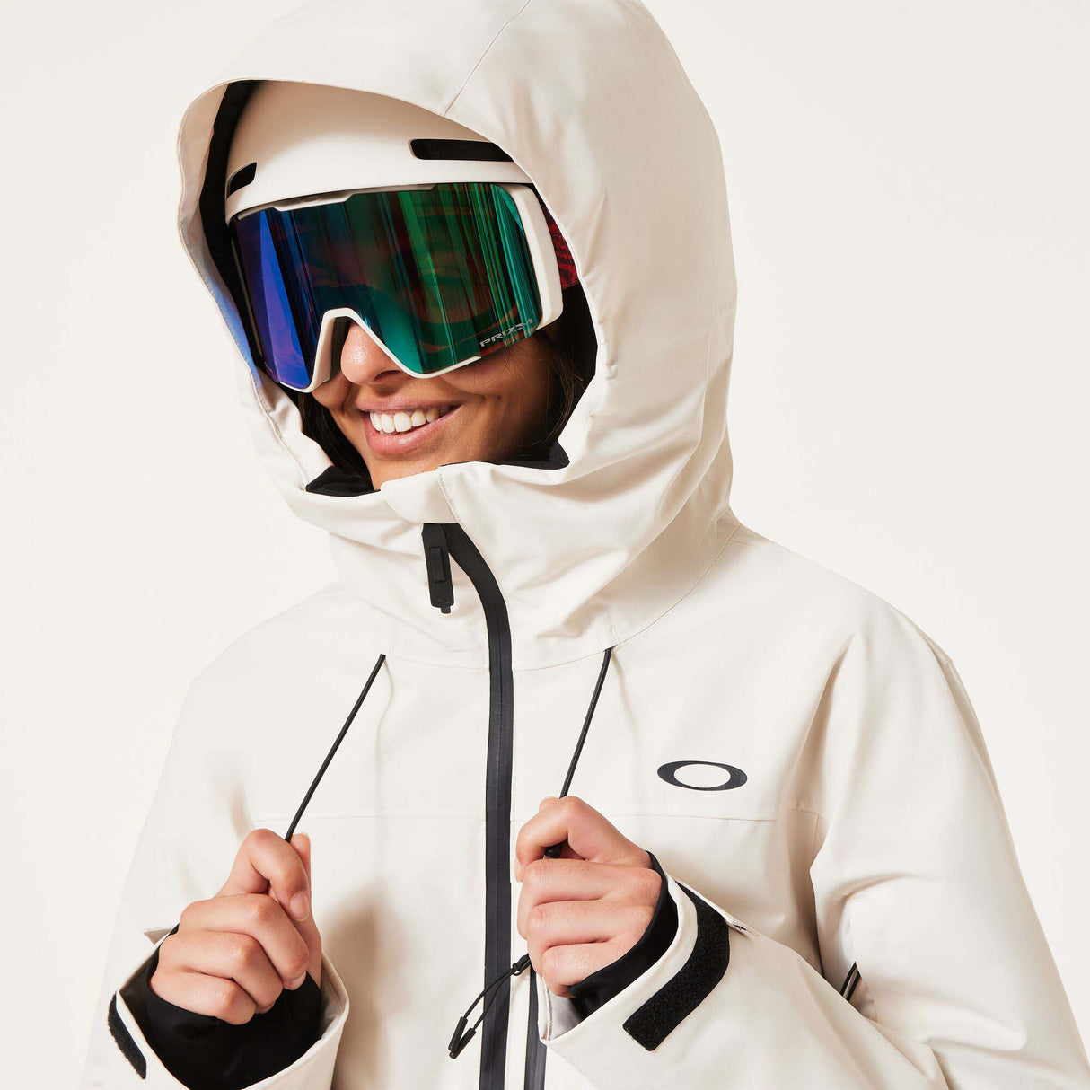 WCanopyInsulatedJacket-An off-white hooded ski jacket with black zipper details and drawstrings, displayed on a neutral light gray background.