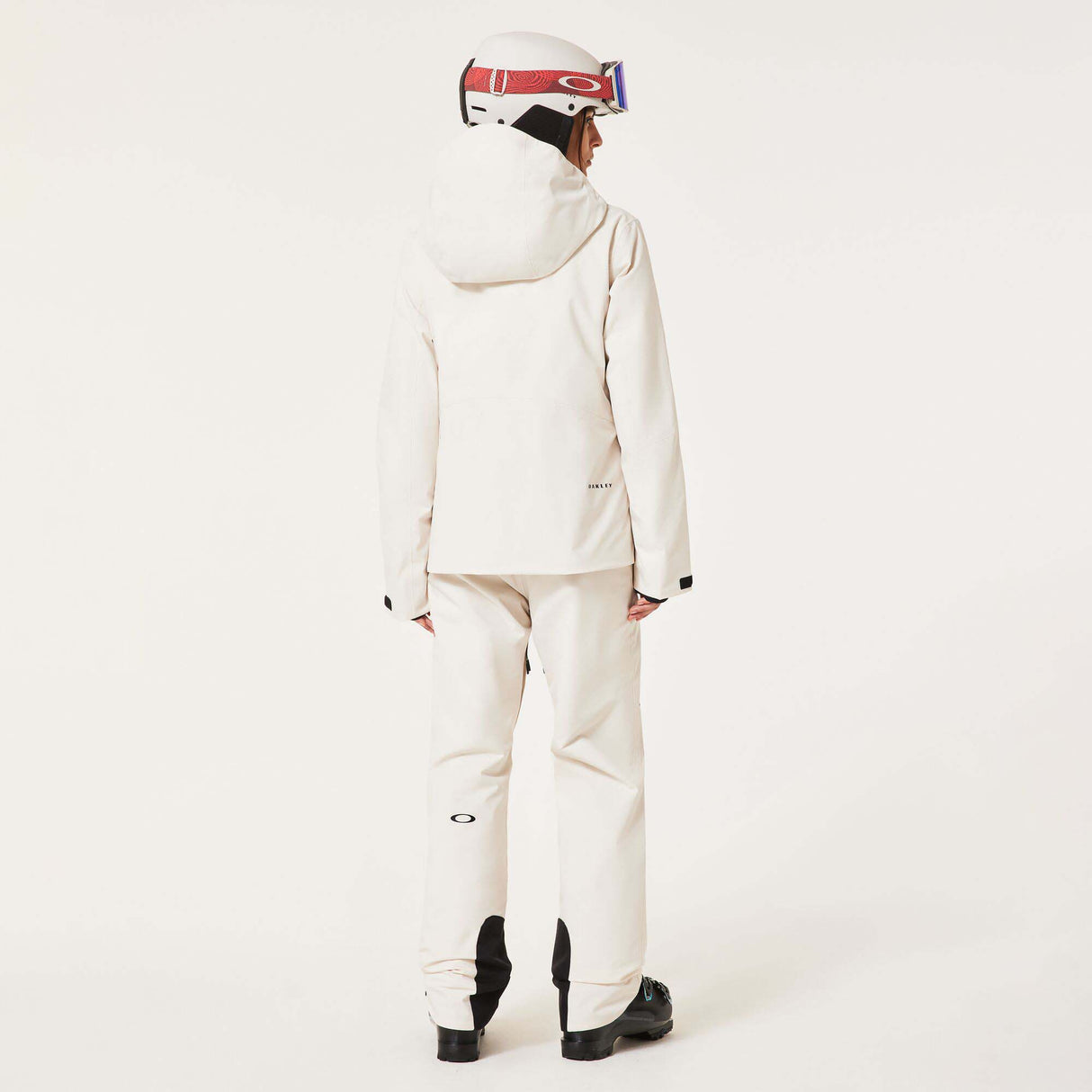 WCanopyInsulatedJacket-An off-white hooded ski jacket with black zipper details and drawstrings, displayed on a neutral light gray background.