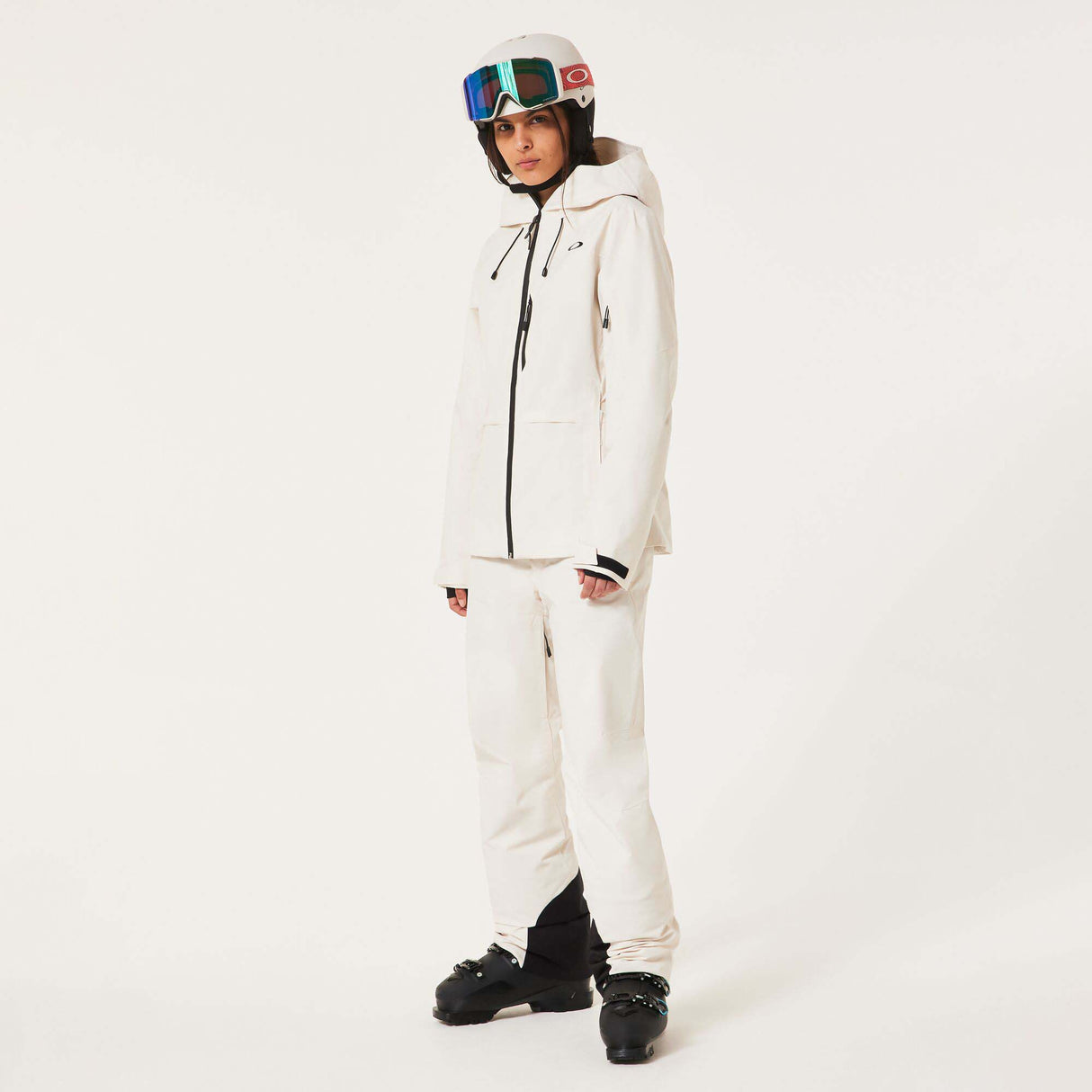 WCanopyInsulatedJacket-An off-white hooded ski jacket with black zipper details and drawstrings, displayed on a neutral light gray background.
