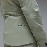WCanopyInsulatedJacket-A light sage green hooded jacket with black zipper and drawstring details, displayed on a neutral gray background. The Oakley logo is visible on the left chest.