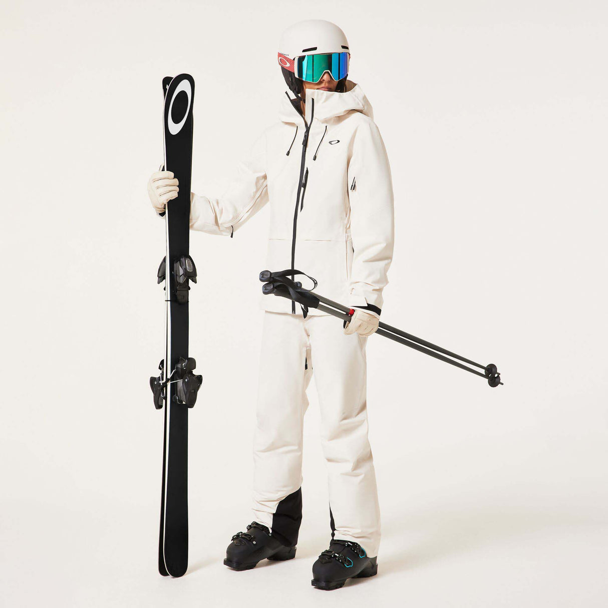 WCanopyInsulatedJacket-An off-white hooded ski jacket with black zipper details and drawstrings, displayed on a neutral light gray background.