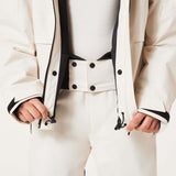 WCanopyInsulatedJacket-An off-white hooded ski jacket with black zipper details and drawstrings, displayed on a neutral light gray background.