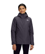 WCartoMonoTriclimateHoodedJacket-Woman wearing a dark gray jacket with a brand logo on a white background