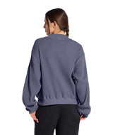 WChabot2.0MockNeck- Woman wearing a purple ribbed mock-neck sweater on a white background