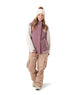 WCheerUpJacket- Woman wearing a pink and cream jacket on a white background 