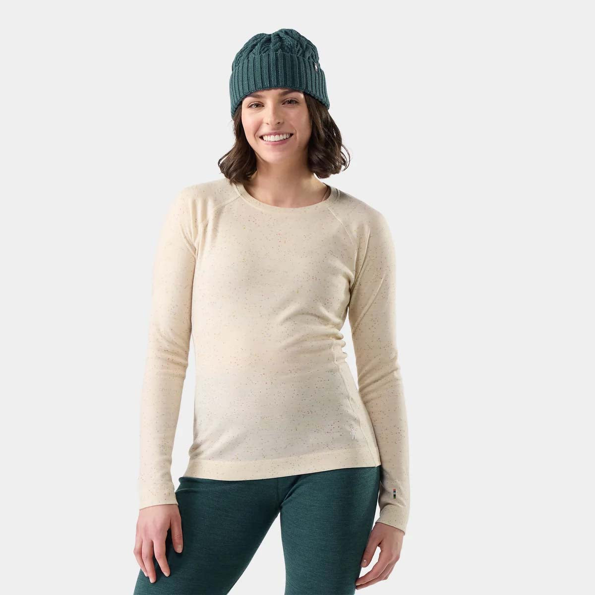 WClassicThermalMerinoBaseLayerCrew-A women's long-sleeve crewneck sweater in a light beige color with a fine multicolor speckled pattern, shown on a plain white background.