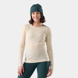 WClassicThermalMerinoBaseLayerCrew-A women's long-sleeve crewneck sweater in a light beige color with a fine multicolor speckled pattern, shown on a plain white background.