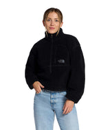 WExtremePile2Pullover- Person wearing a black fleece pullover with a brand logo on a white background