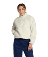 WExtremePile2Pullover- Woman wearing beige fleece pullover with a quarter zip and front pocket on a white background