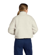 WExtremePile2Pullover- Woman wearing beige fleece pullover with a quarter zip and front pocket on a white background