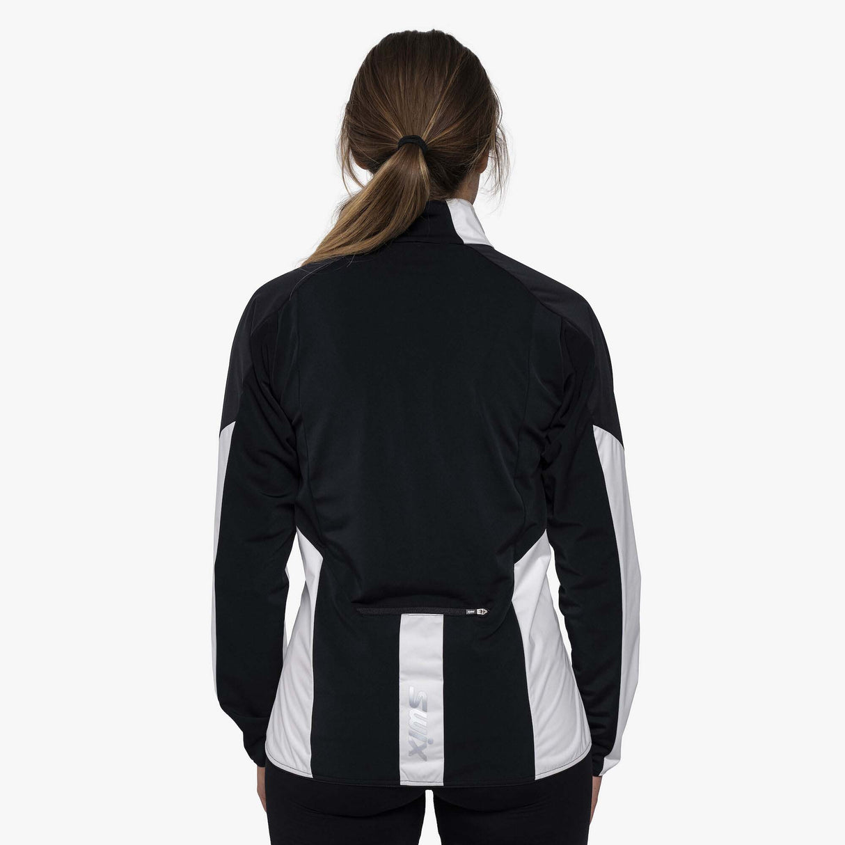 WFocusJacket- A women's colorblock athletic jacket from Swix, featuring a white body, black shoulders and upper chest, and a black front zipper, shown on a plain white background.