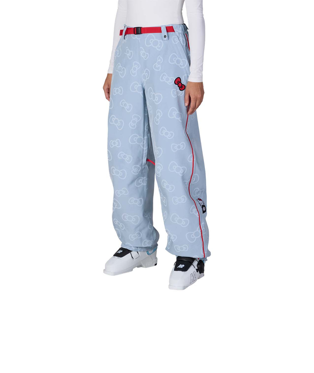 WHelloKittyLilBowShellPant-Light blue pants with pink accents worn by a person on a white background