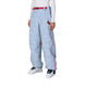 WHelloKittyLilBowShellPant-Light blue pants with pink accents worn by a person on a white background