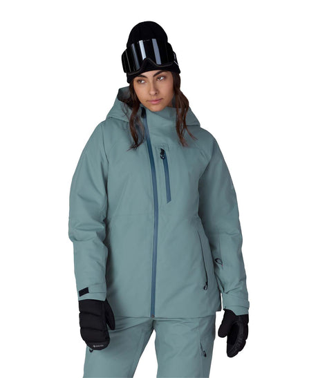 WHydraThermagraphJacket-Person wearing a teal snowsuit with black helmet and gloves on a white background