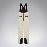 WIcicleSoftshellBib-A pair of ski bib pants in off-white with black suspenders, black zipper details, and black paneling at the lower legs, shown against a neutral gray gradient background.