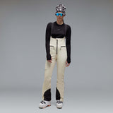 WIcicleSoftshellBib-A pair of ski bib pants in off-white with black suspenders, black zipper details, and black paneling at the lower legs, shown against a neutral gray gradient background.