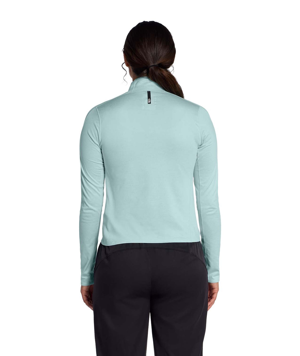 WJaida1_4Zip- Woman wearing a light blue long-sleeve quarter zip shirt on a white background