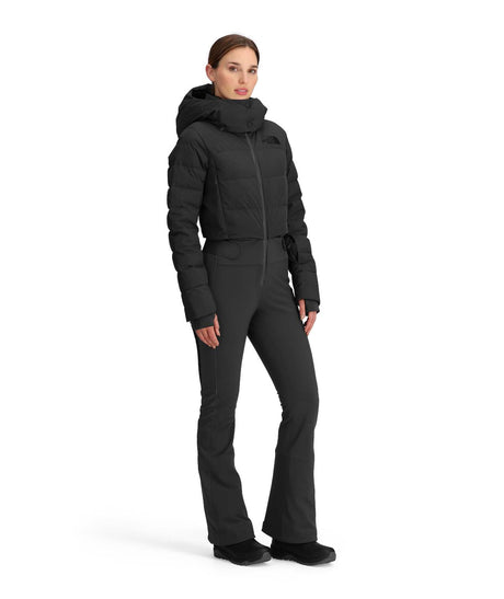 WOffTheClockOne-Piece-Woman wearing a black winter outfit on a white background