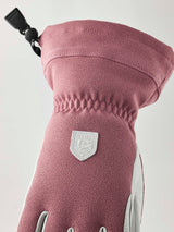 WPatrolGauntletGlove-Pair of pink and white gloves with a visible brand logo on a white background