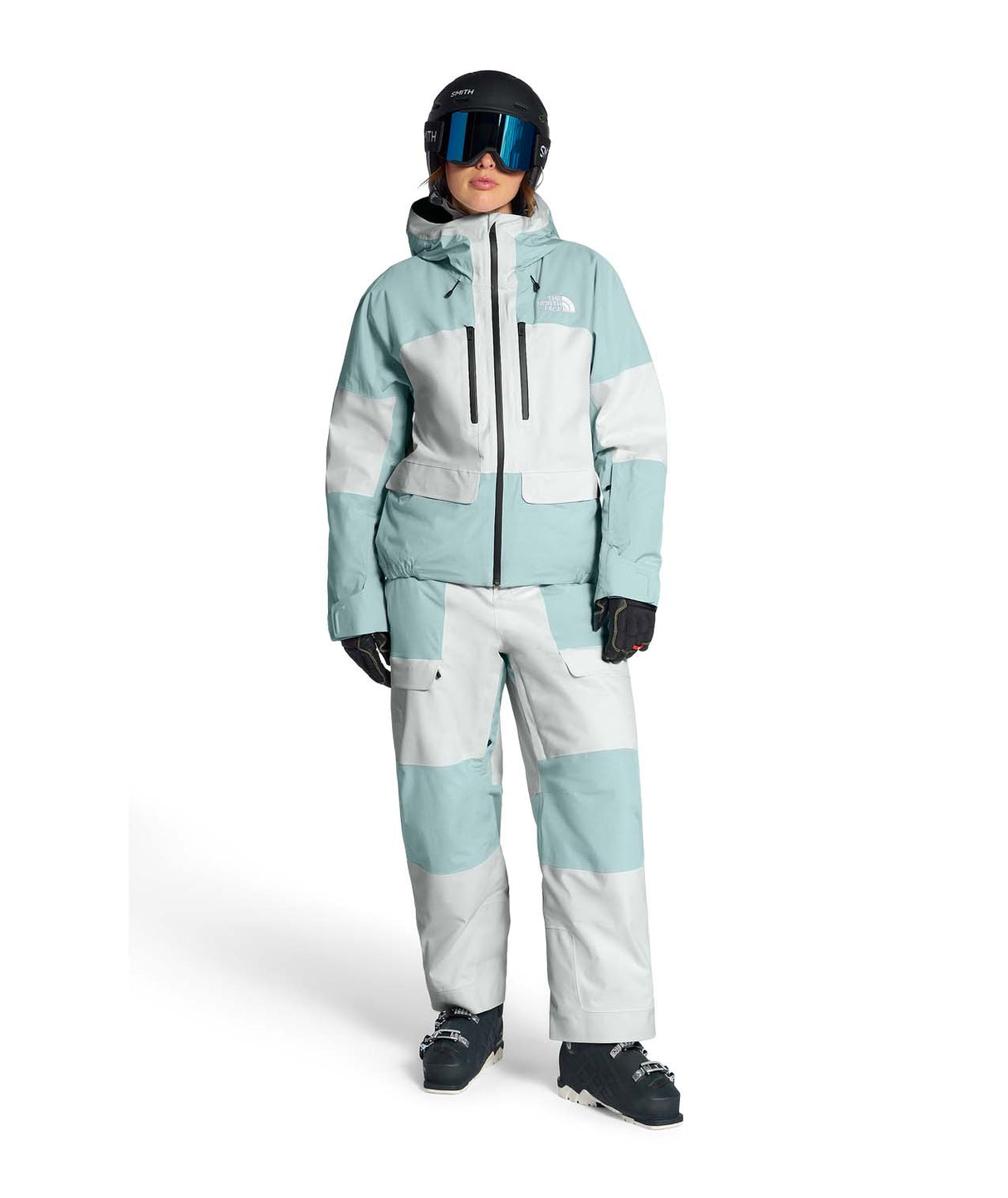 WPowstarPant-Person wearing a light blue and white snowsuit with goggles on a white background