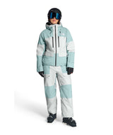 WPowstarPant-Person wearing a light blue and white snowsuit with goggles on a white background