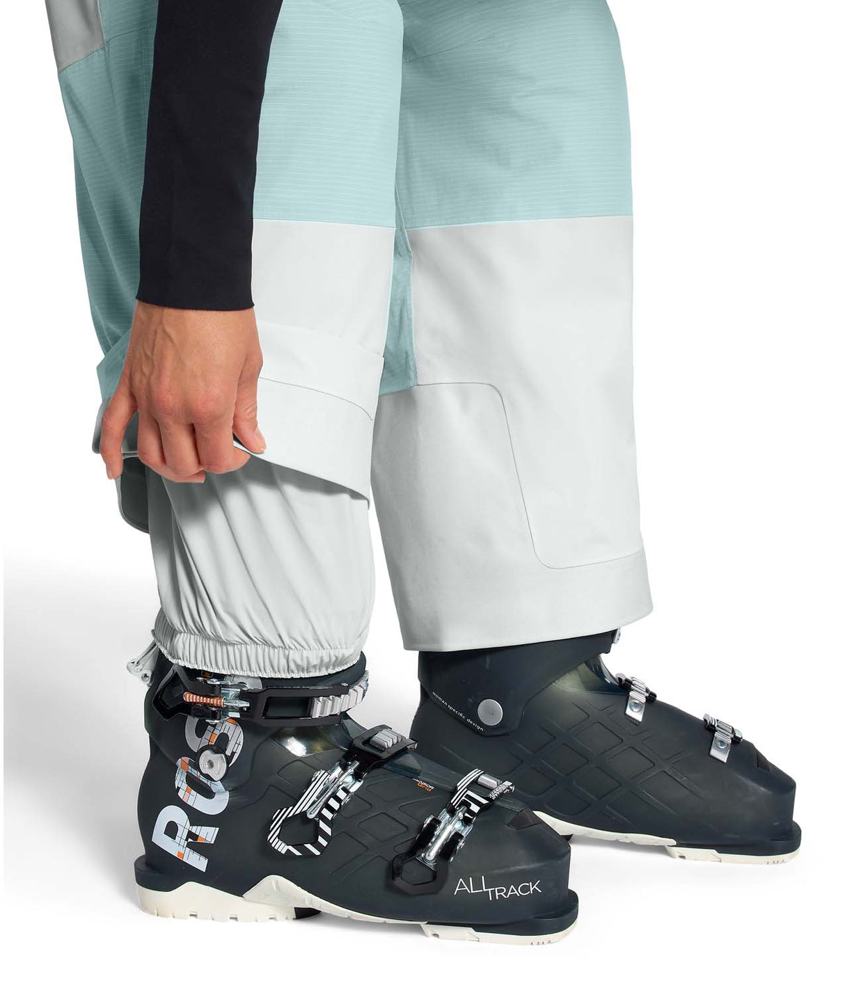 WPowstarPant-Color-blocked pants with light blue and white sections on a white background