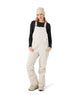 WRideoutBib- Woman wearing cream bibs on a white background