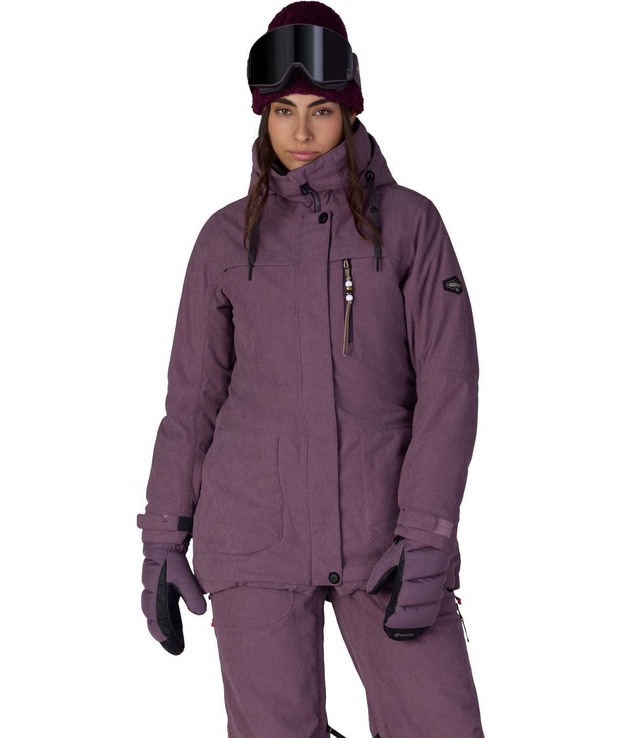 WSpiritInsulatedJacket-Person wearing a purple snowsuit with goggles on a white background