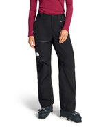 WSummitEastwallGTXPant-Person wearing black pants with a brand logo on a white background