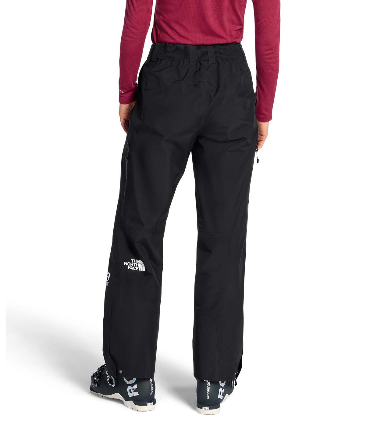 WSummitEastwallGTXPant-Person wearing black pants with a brand logo on a white background