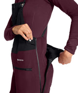 WSummitVerbierGTXBib-Maroon snow pants with black zippers and a visible brand logo on a white background