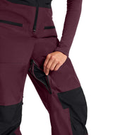 WSummitVerbierGTXBib-Maroon and black pants with a person wearing them on a white background