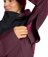 WSummitVerbierGTXJacket-Person wearing a maroon and black jacket with a hood on a white background