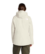 WTHERMOBALLSnowTriclimate-Person wearing a beige jacket with a brand logo on a white background