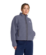 WTNFFleeskiFullZipJacket- Person wearing a purple fleece jacket with The North Face logo on a white background